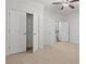 Bright bedroom with carpeted floors, ceiling fan, and a double closet at 2040 Bloomfield Ct, Cumming, GA 30041