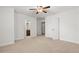 Bright bedroom with carpeted floors, ceiling fan, and access to an ensuite bathroom at 2040 Bloomfield Ct, Cumming, GA 30041