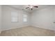Bedroom featuring carpet, two windows and ceiling fan at 2040 Bloomfield Ct, Cumming, GA 30041