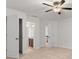 Bright bedroom with carpeted floors, ceiling fan, and access to an ensuite bathroom and multiple closets at 2040 Bloomfield Ct, Cumming, GA 30041