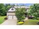 Charming two-story home with a manicured lawn and a two car garage at 2040 Bloomfield Ct, Cumming, GA 30041