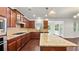 Well-appointed kitchen features granite countertops, stainless steel appliances, and hardwood floors at 2040 Bloomfield Ct, Cumming, GA 30041