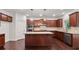 Modern kitchen features granite countertops, stainless steel appliances, and a large center island at 2040 Bloomfield Ct, Cumming, GA 30041