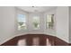 Bright living area with hardwood floors, offering versatility and ample space at 2040 Bloomfield Ct, Cumming, GA 30041