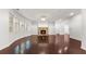 Spacious living room features hardwood floors, a stone fireplace, and large windows with abundant natural light at 2040 Bloomfield Ct, Cumming, GA 30041