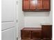 Mudroom featuring a bench, storage cabinets and a white door at 2040 Bloomfield Ct, Cumming, GA 30041