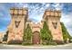 Medieval Times entrance with stone facade, castle-like turrets, and detailed heraldic symbols at 2405 Malster Ln, Lawrenceville, GA 30043
