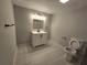 Modern bathroom featuring a vanity, illuminated mirror, and sleek tiling, and fixtures at 766 Longleaf Dr, Forest Park, GA 30297