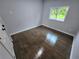 The bedroom offers a window view of the outside, complemented by the light and dark hardwood flooring at 766 Longleaf Dr, Forest Park, GA 30297