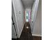 Long hallway has fresh paint, new doors and provides access to the various rooms in the home at 766 Longleaf Dr, Forest Park, GA 30297