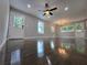 This bright living area has gleaming hardwood floors, large windows, and easy access to outdoor living spaces at 766 Longleaf Dr, Forest Park, GA 30297