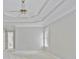 Neutral primary bedroom featuring a trey ceiling, bay windows, with a bathroom doorway at 963 Bolingbrook Sw Dr, Marietta, GA 30064