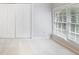 Bright bedroom featuring double closets and a window with natural light and views of the outdoors at 963 Bolingbrook Sw Dr, Marietta, GA 30064