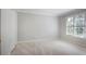Neutral bedroom with carpet, a window with blinds and a closet for storage at 963 Bolingbrook Sw Dr, Marietta, GA 30064