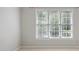 Minimalist bedroom with three windows providing natural light and a view of the outdoors at 963 Bolingbrook Sw Dr, Marietta, GA 30064