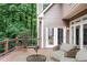 An outdoor deck with seating, a view of trees, and access to the home at 963 Bolingbrook Sw Dr, Marietta, GA 30064