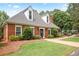 Charming brick home with a landscaped front yard and a welcoming entrance at 963 Bolingbrook Sw Dr, Marietta, GA 30064