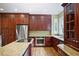 Kitchen with granite island, stainless appliances, wood cabinets, and hardwood floors at 963 Bolingbrook Sw Dr, Marietta, GA 30064