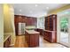 Spacious kitchen with granite counters, wood cabinets, stainless appliances, and island cooktop at 963 Bolingbrook Sw Dr, Marietta, GA 30064
