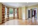 Spacious living room featuring hardwood floors, ample natural light, and decorative window treatments at 963 Bolingbrook Sw Dr, Marietta, GA 30064