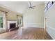 Open living room with fireplace, hardwood floors, and large windows offering natural light at 963 Bolingbrook Sw Dr, Marietta, GA 30064