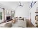 Inviting living room with brick fireplace and large windows offering lots of natural light at 963 Bolingbrook Sw Dr, Marietta, GA 30064