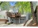 The exterior features a private deck perfect for entertaining, with convenient garage access and lush greenery at 29 Greenland Trce, Atlanta, GA 30342