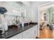 Wet bar with open shelving, countertop space, and a view of the living area at 29 Greenland Trce, Atlanta, GA 30342
