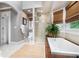 Contemporary bathroom featuring a glass shower and a soaking tub at 29 Greenland Trce, Atlanta, GA 30342