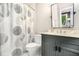 Bathroom features a vanity, commode, stylish shower curtain, and a mirror at 29 Greenland Trce, Atlanta, GA 30342