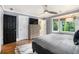 This bedroom features a bay window, hardwood floors, stylish decor, and a ceiling fan at 29 Greenland Trce, Atlanta, GA 30342