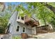 The exterior features a private deck perfect for entertaining, with convenient garage access and lush greenery at 29 Greenland Trce, Atlanta, GA 30342