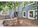 Charming blue-brick home features a cozy front entrance with a well-manicured yard and inviting walkway at 29 Greenland Trce, Atlanta, GA 30342