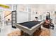 Spacious game room with pool table, workout area, and a rustic modern design at 29 Greenland Trce, Atlanta, GA 30342