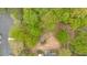 Aerial shot of the property surrounded by mature trees, close to nearby parking and neighborhood at 484 Lorene Sw Dr, Marietta, GA 30060