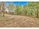 Beautiful expansive backyard with plenty of room for recreational activities with trees providing a private feel at 484 Lorene Sw Dr, Marietta, GA 30060