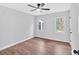 Bedroom featuring neutral walls, a ceiling fan, and two windows for natural light at 484 Lorene Sw Dr, Marietta, GA 30060