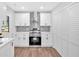 Well-lit kitchen featuring stainless steel appliances, white cabinets, and a spacious layout at 484 Lorene Sw Dr, Marietta, GA 30060