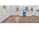 Bright eat-in kitchen with white cabinets, stainless steel appliances, and light wood-look flooring at 484 Lorene Sw Dr, Marietta, GA 30060