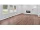 Living room with new floors, fireplace, neutral walls, and bright natural light at 484 Lorene Sw Dr, Marietta, GA 30060