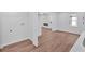 Open-concept living area with wood-look flooring, neutral paint, and ample natural light at 484 Lorene Sw Dr, Marietta, GA 30060