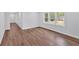 Living room featuring new floors, neutral walls, and bright windows at 484 Lorene Sw Dr, Marietta, GA 30060