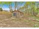 Image of a wooden storage shed, offering ample outdoor storage space for gardening tools and equipment at 484 Lorene Sw Dr, Marietta, GA 30060