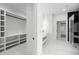 Modern bathroom features marble floors, double vanity, walk-in shower, and closet at 859 N Bay Overlook, Villa Rica, GA 30180