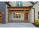 This home as a charming covered front porch with a stylish design at 859 N Bay Overlook, Villa Rica, GA 30180