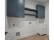 Functional laundry room with sink, modern cabinets, and stylish finishes at 859 N Bay Overlook, Villa Rica, GA 30180