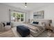 Comfortable primary bedroom with large windows and soft decor at 859 N Bay Overlook, Villa Rica, GA 30180