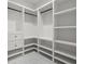 Custom walk-in closet with white shelving and drawers for ample storage at 859 N Bay Overlook, Villa Rica, GA 30180