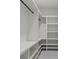 Custom walk-in closet with white shelving and ample storage space at 859 N Bay Overlook, Villa Rica, GA 30180