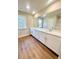 Bright bathroom boasts double sinks, modern countertops, and stylish vanities at 2407 Malster Ln, Lawrenceville, GA 30043